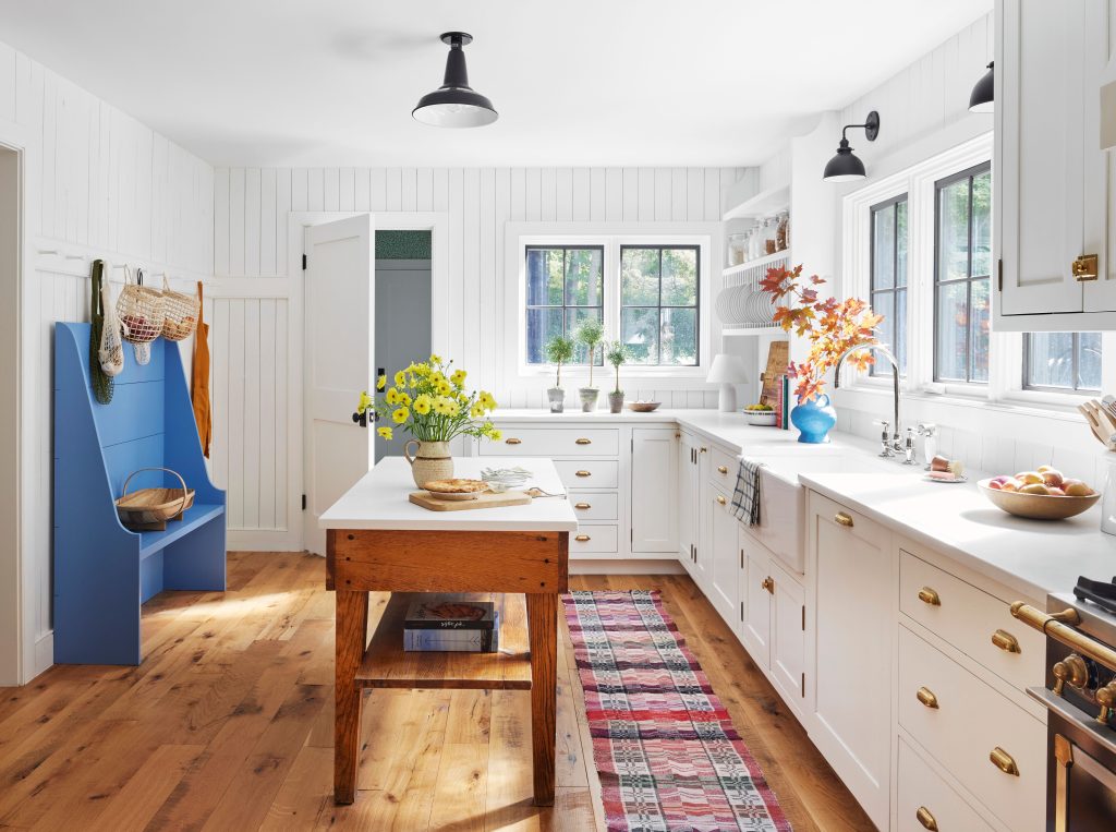 white kitchen with wood island
