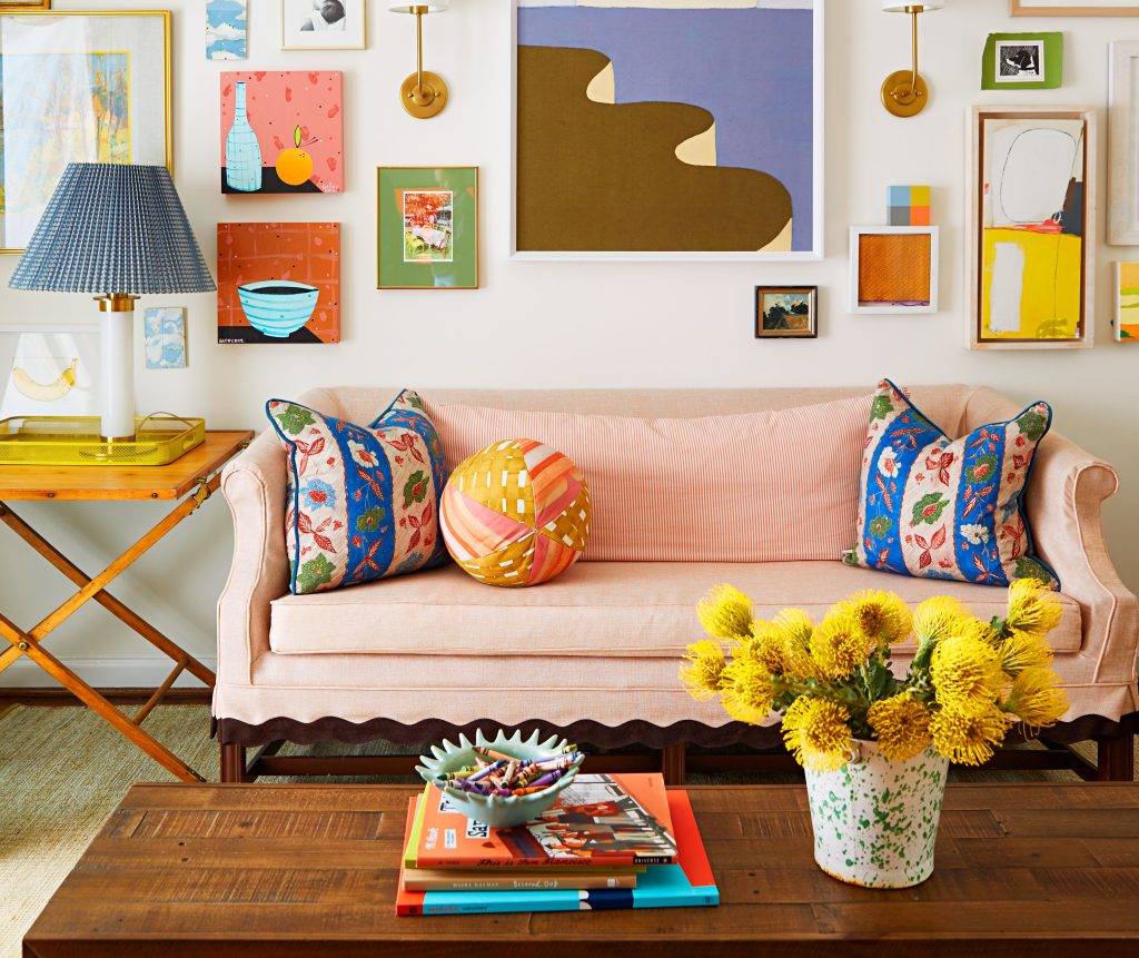 Living room with pink sofa and gallery wall