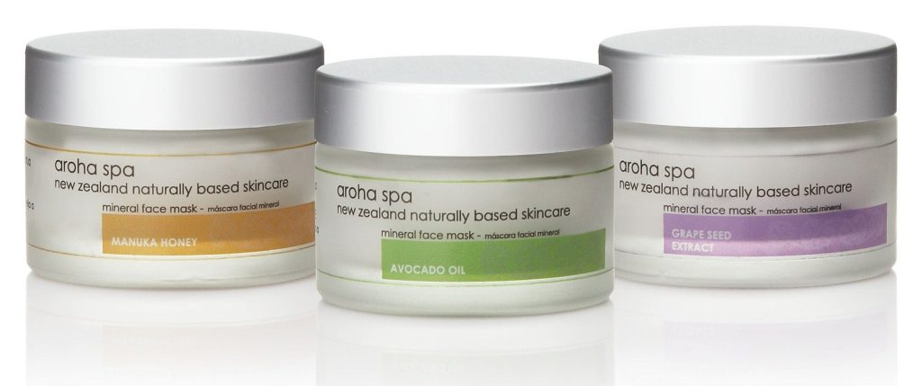 Three branded mineral face-mask jars labeled Manuka Honey, Avocado Oil, and Grape Seed Extract